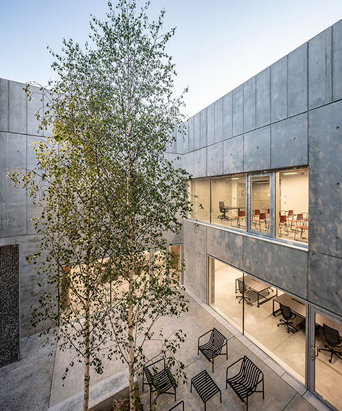 randja architects completes robust stone & concrete technology park in france