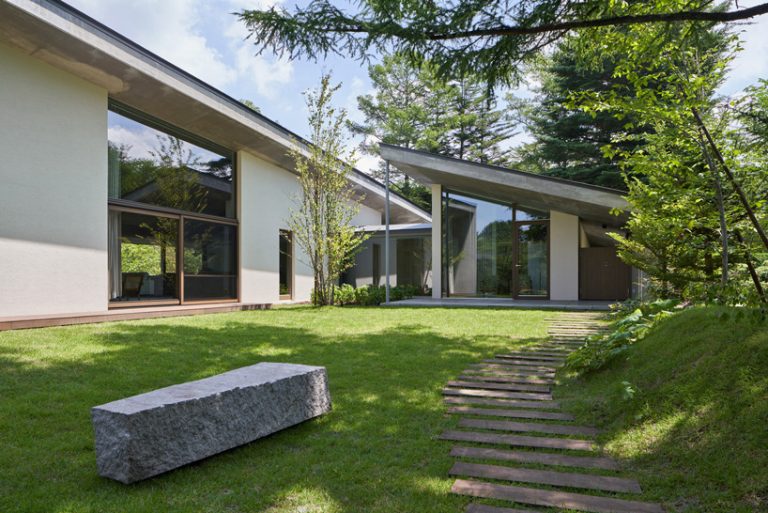 r.e.a.d. & architects tops 'symbiotic house' with sloping concrete roof ...