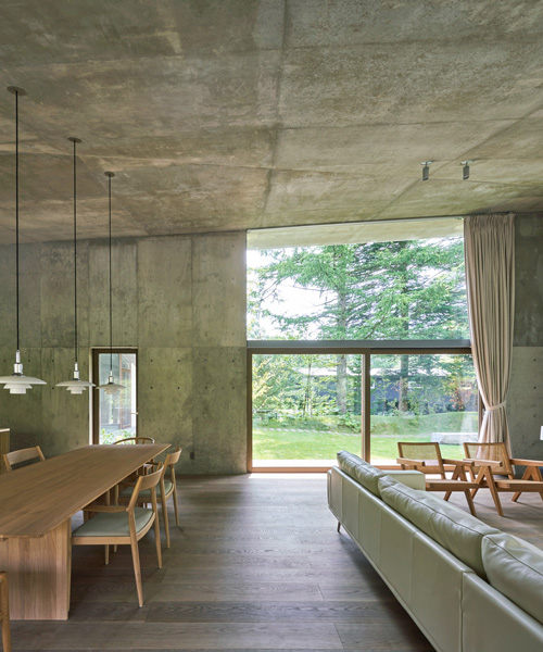 r.e.a.d. & architects tops 'symbiotic house' with sloping concrete roof in karuizawa, japan