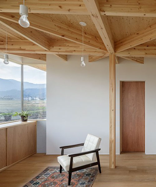 geometric wooden grid frame supports 'nanto house' by kazuto nishi architects in japan
