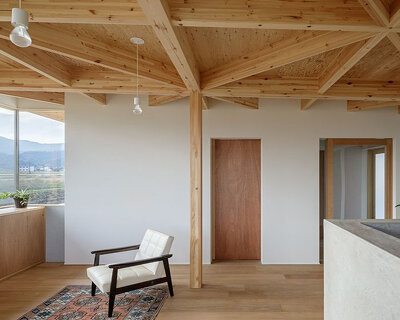 geometric wooden grid frame supports 'nanto house' by kazuto nishi architects in japan