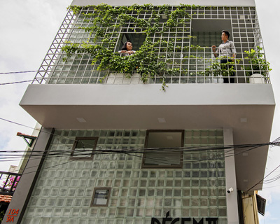room+ design & build renovates tiny house in vietnam with glass-block façades
