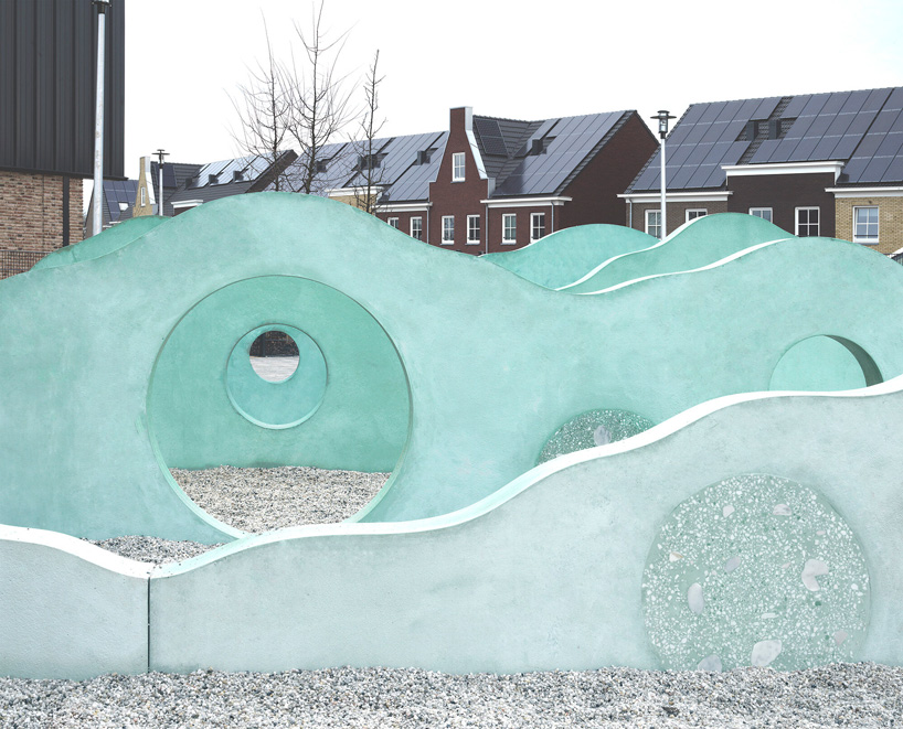 studio ossidiana creates colorful concrete landscape for school playground in the netherlands