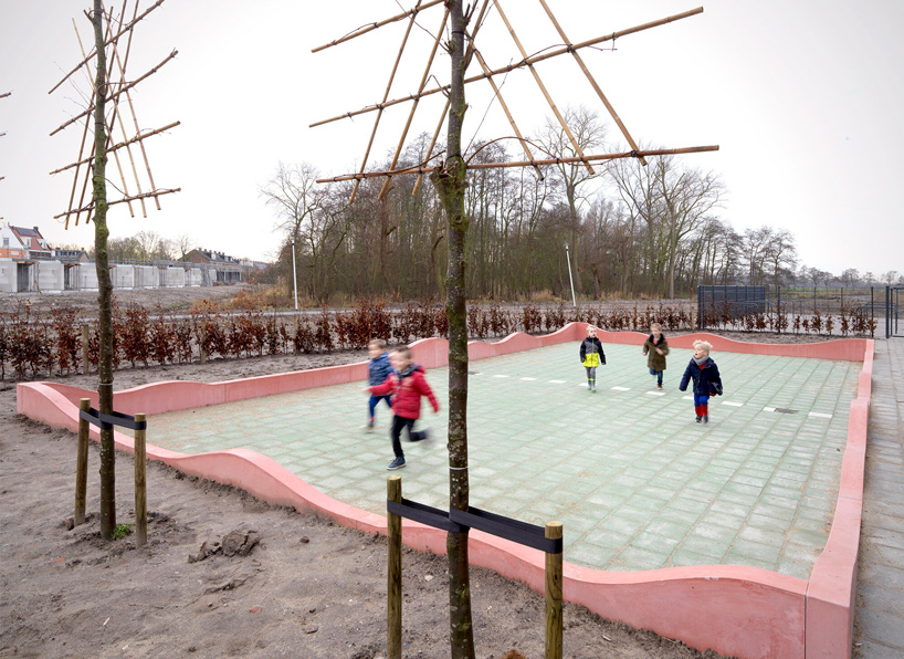 studio ossidiana creates colorful concrete landscape for school playground in the netherlands