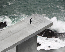 luiz eduardo lupatini designs a monumental concrete structure anchored off the algarve coast