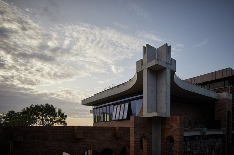 jesse bennett studio builds australian house with brick archways + concrete roof cap