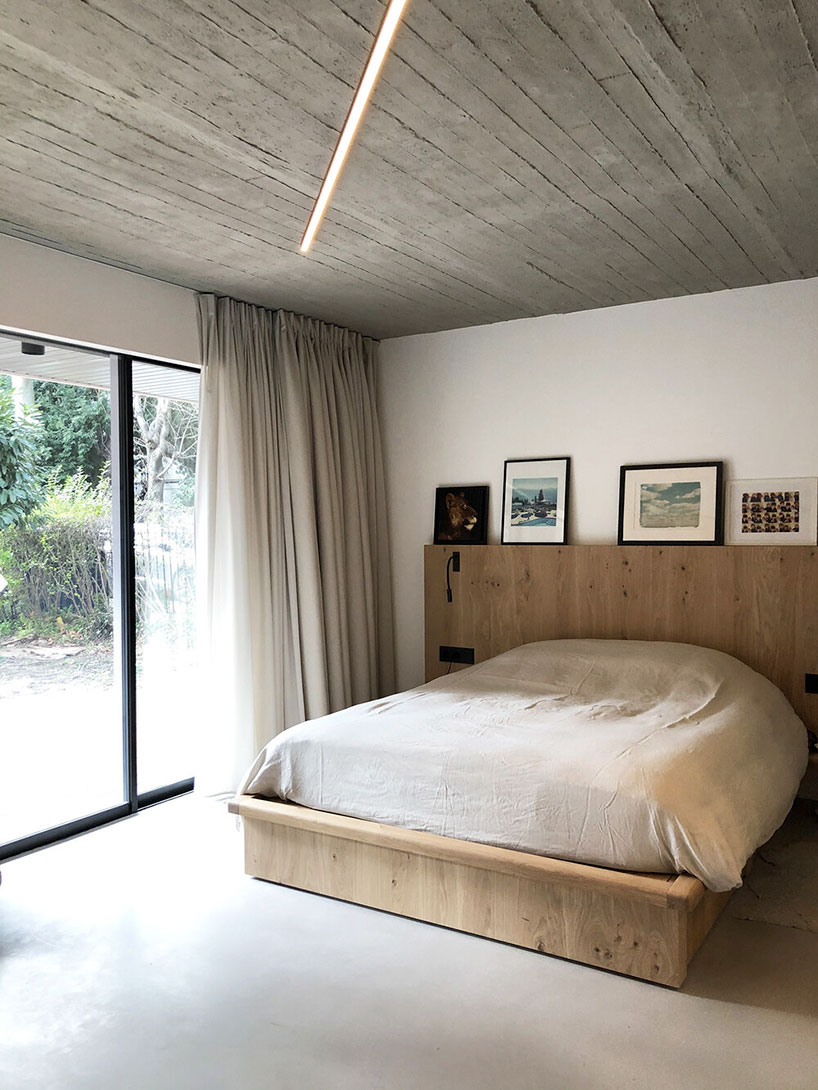 toledano + architects adds geometric wood + metal staircase to apartment in paris