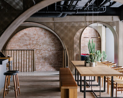 successive bronze arches define 'house of madison' concept store by via. in hong kong