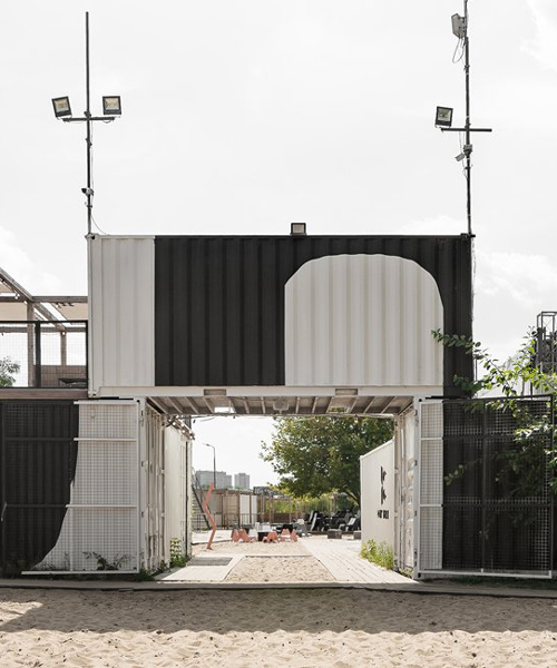 wiercinski studio recycles 23 shipping containers to build a cultural center in poznan