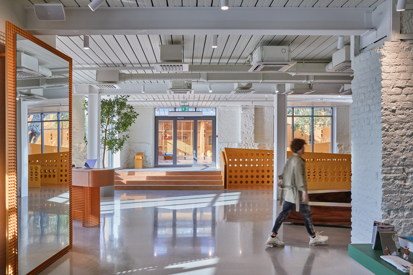 energetic orange adorns the zuzeum art center in riga, designed by annvil designboom
