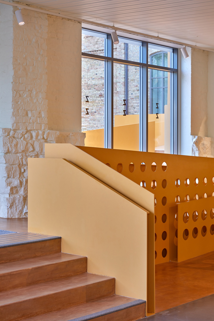 energetic orange adorns the zuzeum art center in riga, designed by annvil designboom