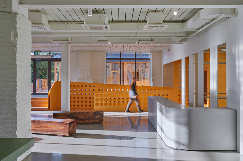 energetic orange adorns the zuzeum art center in riga, designed by annvil designboom