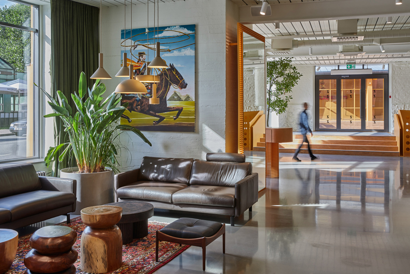 energetic orange adorns the zuzeum art center in riga, designed by annvil designboom