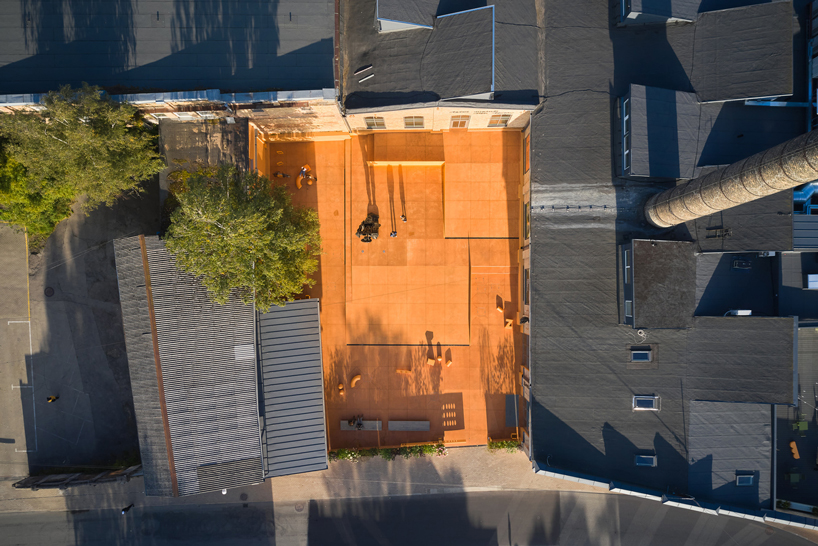 energetic orange adorns the zuzeum art center in riga, designed by annvil designboom