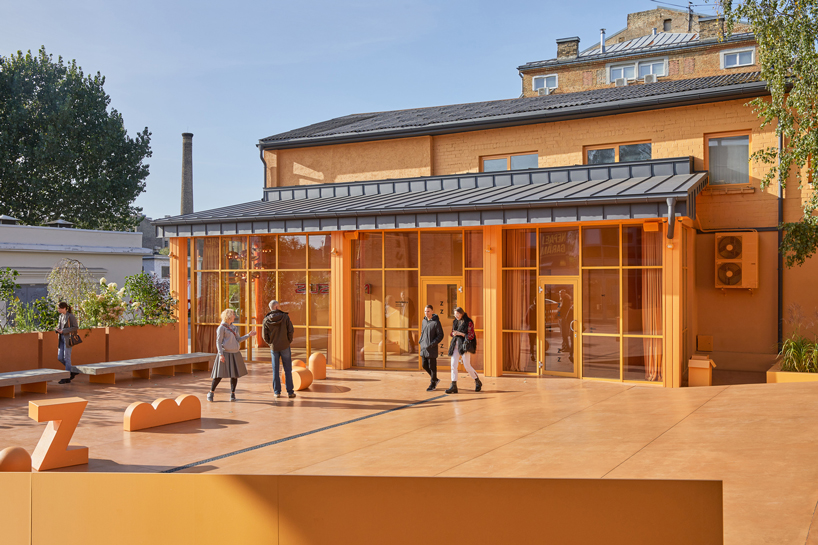 energetic orange adorns the zuzeum art center in riga, designed by annvil designboom