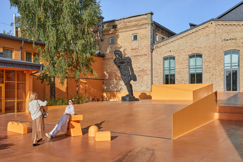 energetic orange adorns the zuzeum art center in riga, designed by annvil designboom