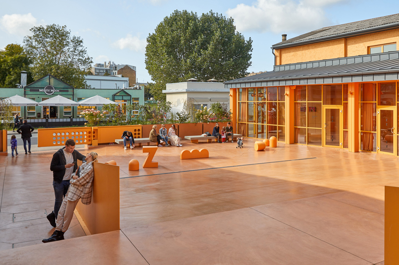 energetic orange adorns the zuzeum art center in riga, designed by annvil designboom