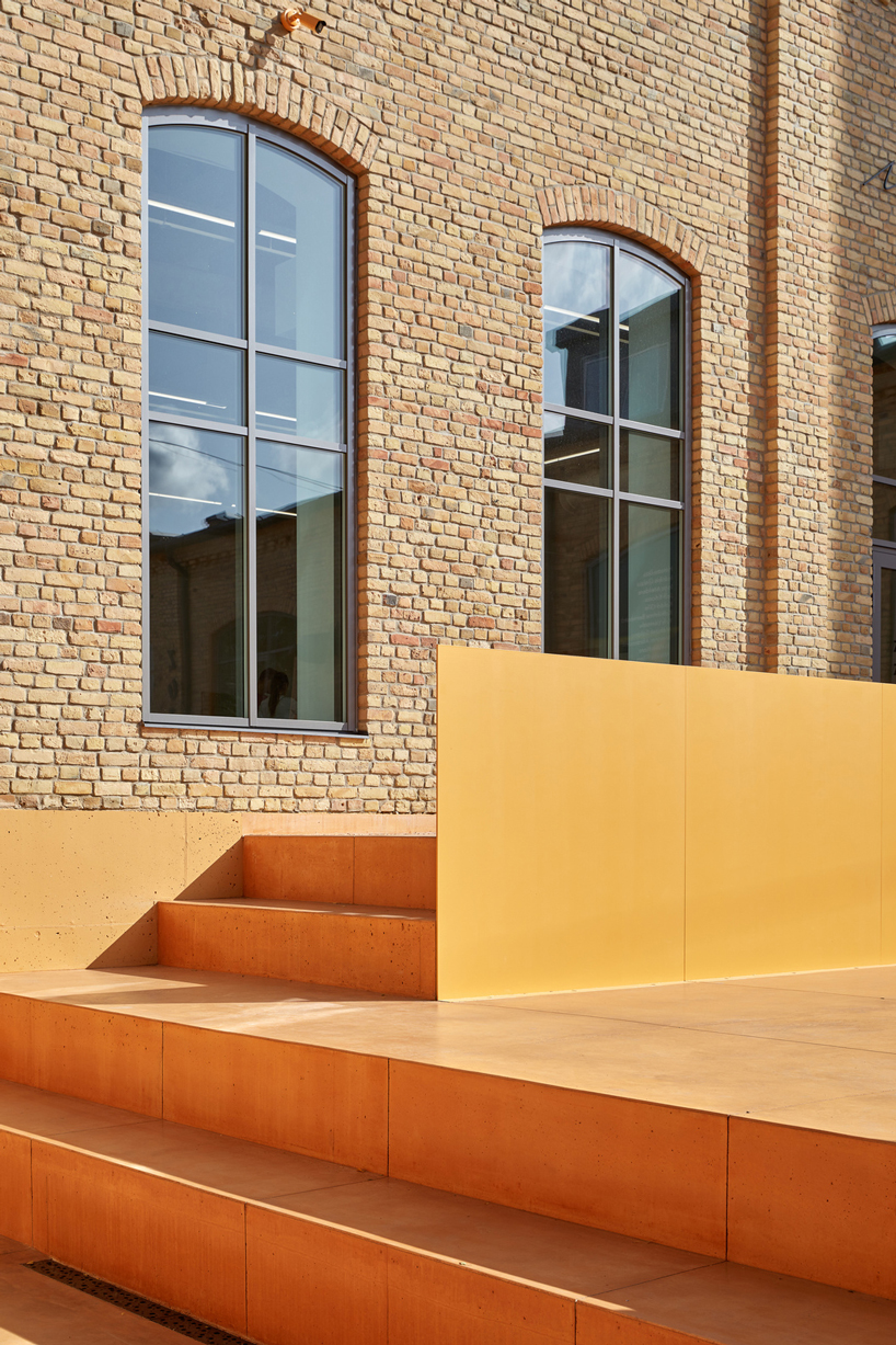 energetic orange adorns the zuzeum art center in riga, designed by annvil designboom