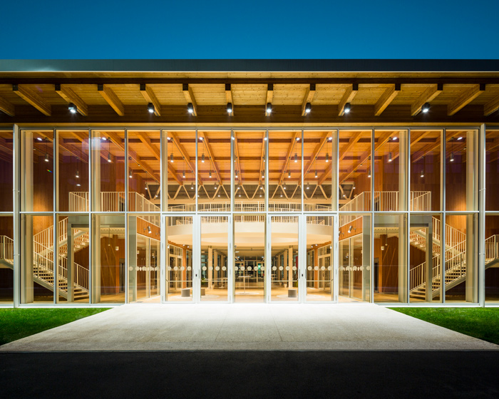 AMDL CIRCLE's Z-LIFE workspace occupies a glass box within an industrial factory