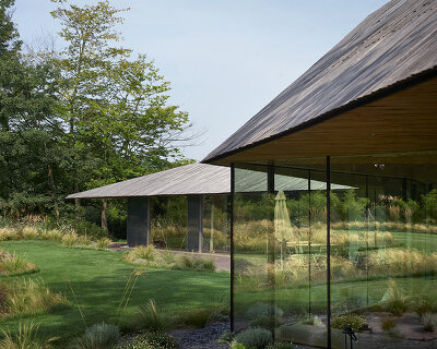 TANK conceals 'maison mouvaux' beneath sculptural wooden roof in northern france