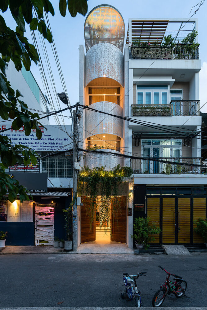 tube-shaped, perforated steel façade clads AD9 architects' lvs.house in ...