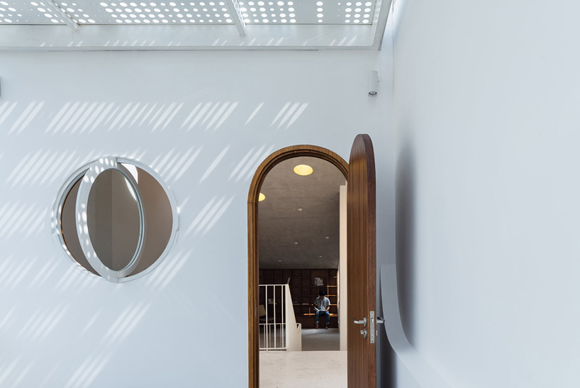 tube-shaped, perforated steel façade clads AD9 architects' lvs.house in vietnam