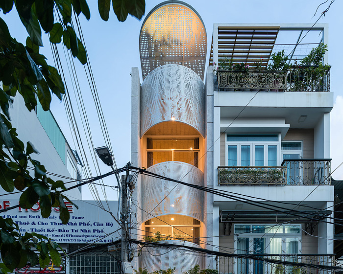 tube-shaped, perforated steel façade clads AD9 architects' lvs.house in vietnam