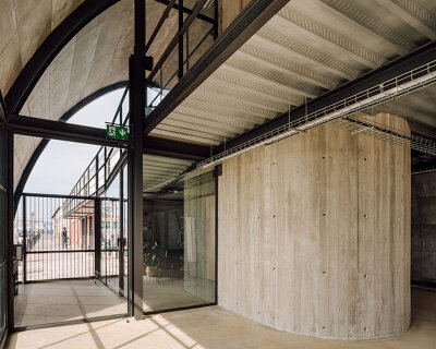 vaulted warehouse in lisbon revitalized by antónio costa lima as waterfront offices