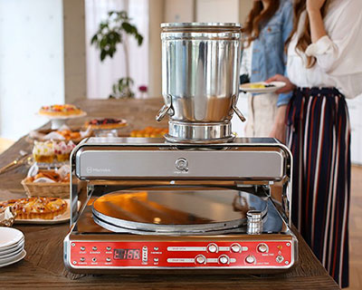 this automatic crepe making device looks like a vintage record player