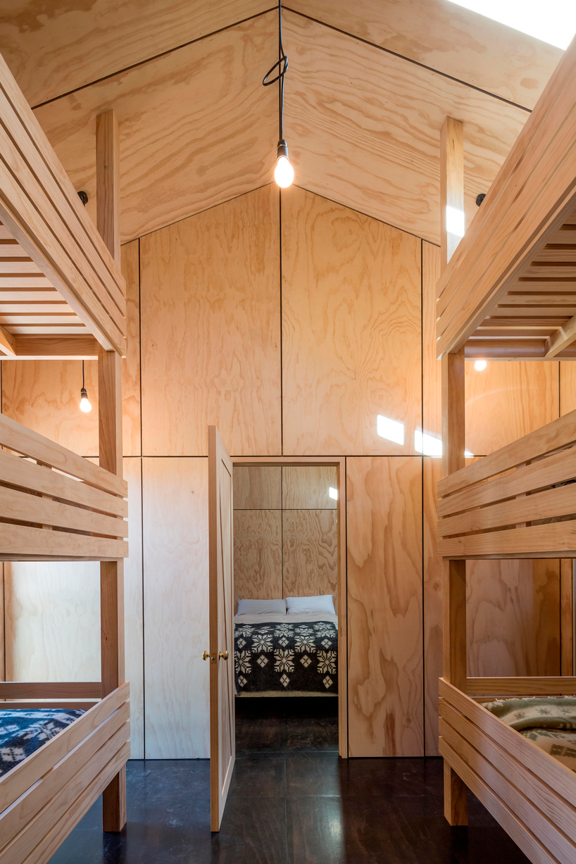 RTA studio nestles a timber-clad holiday home into new zealand's southern alps