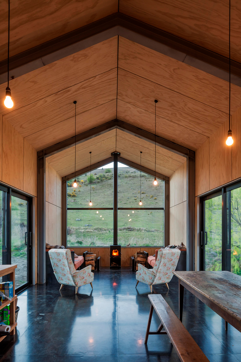 RTA studio nestles a timber-clad holiday home into new zealand's southern alps