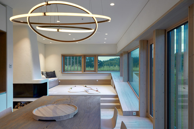 arches wraps 'cedar house' in façade of wood shingles in lithuania