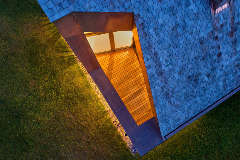 arches wraps 'cedar house' in façade of wood shingles in lithuania