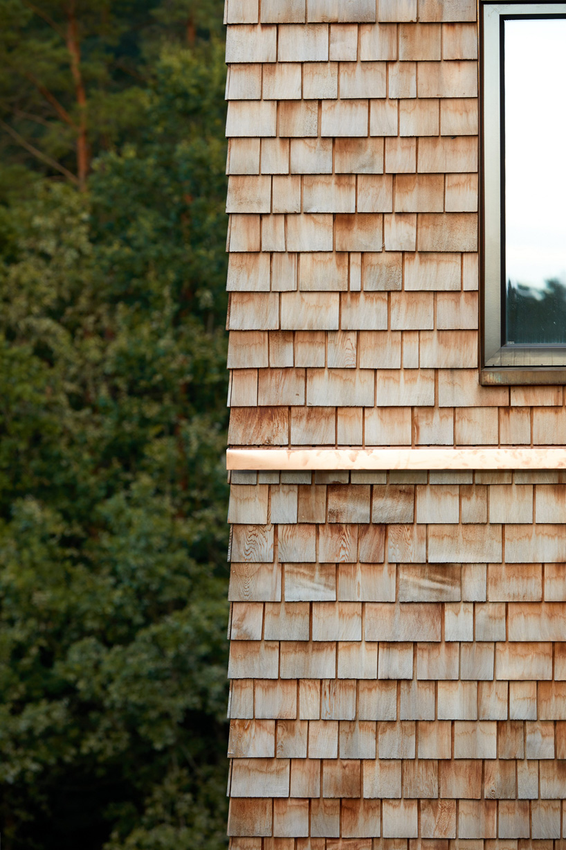 detail of shingles in cedar house by arches in lithuania