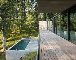 linear concrete residence by govaert & vanhoutte architects blends in belgian forest