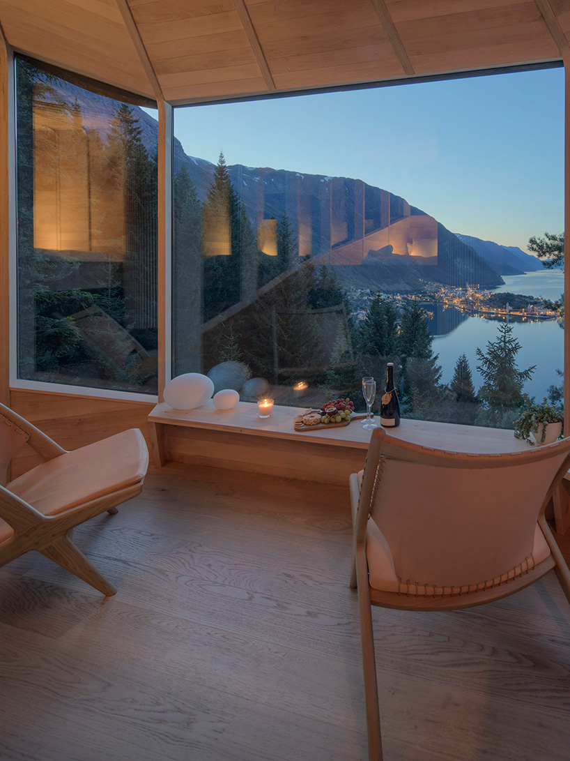 helen & hard fastens woodnest treehouse to living pine tree in norway