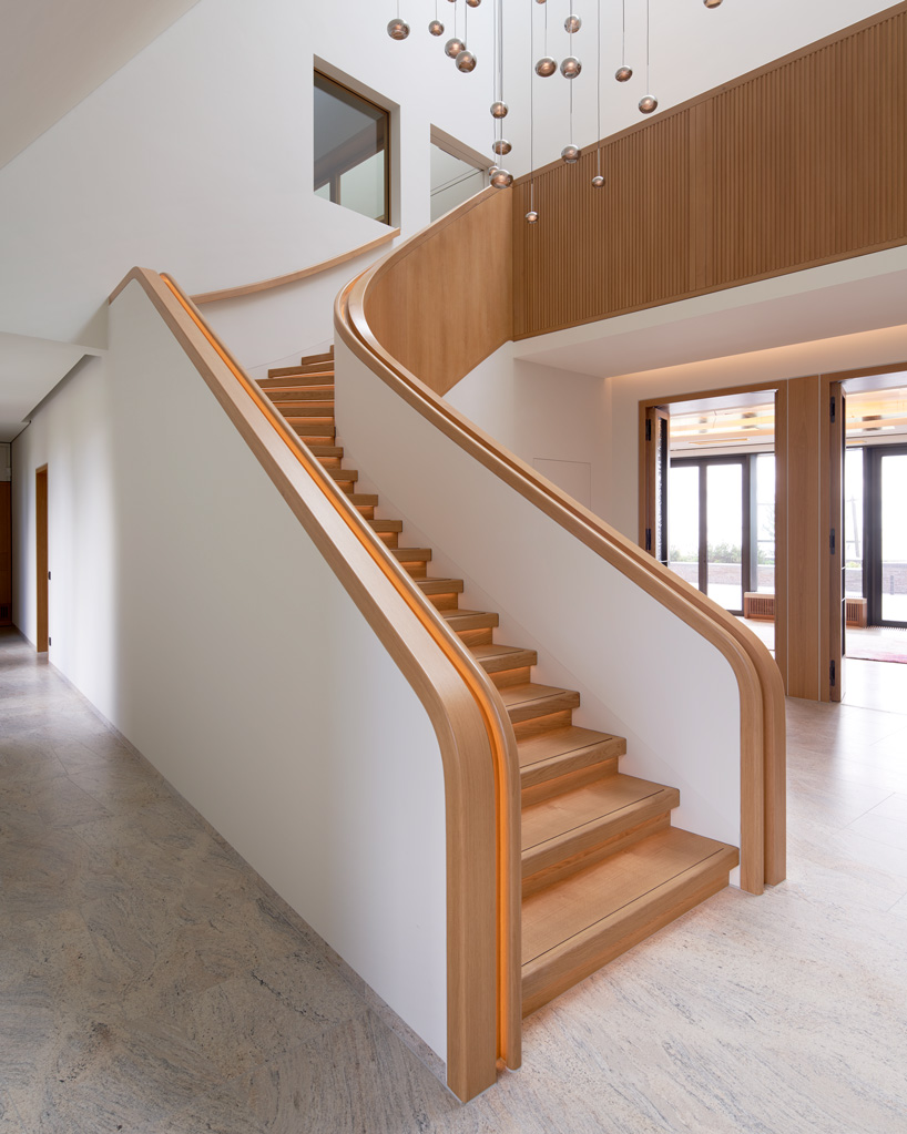 thatched hip roof tops hubschmitz architekten's house on föhr island, germany