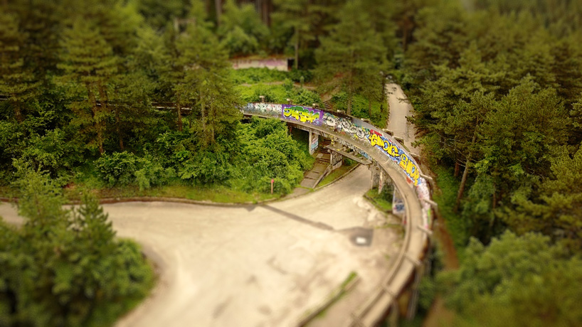 forest and graffiti covered bridge