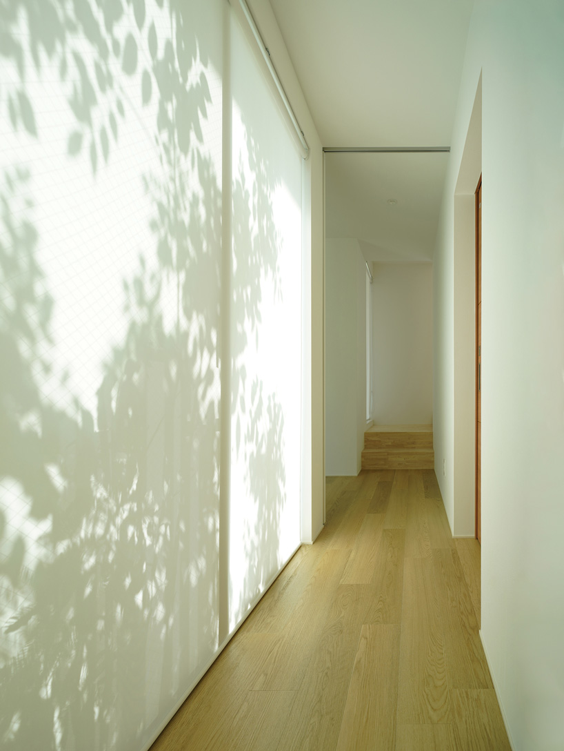 jun murata completes japanese guesthouse with small courtyard where light + shadow play