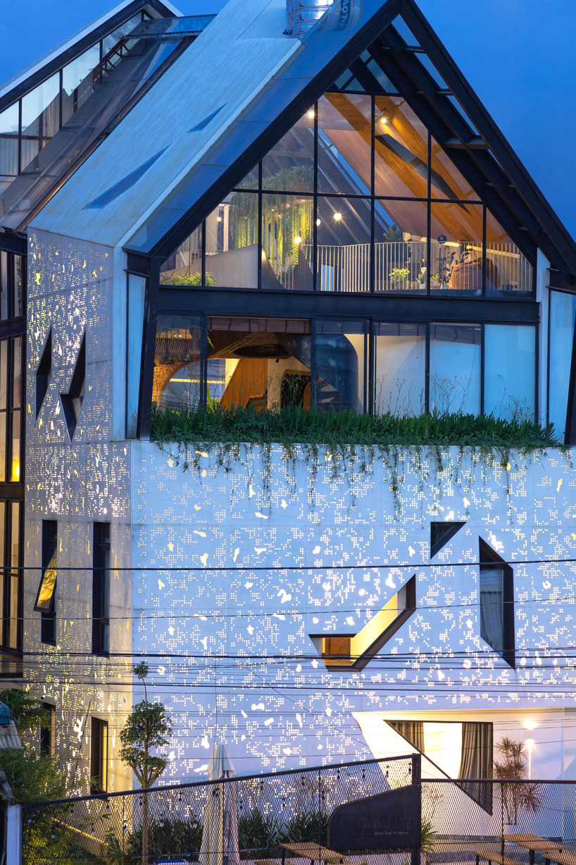 le house transforms vietnamese hotel into shining lantern with perforated steel façade
