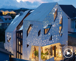 le house transforms vietnamese hotel into shining lantern with perforated steel façade