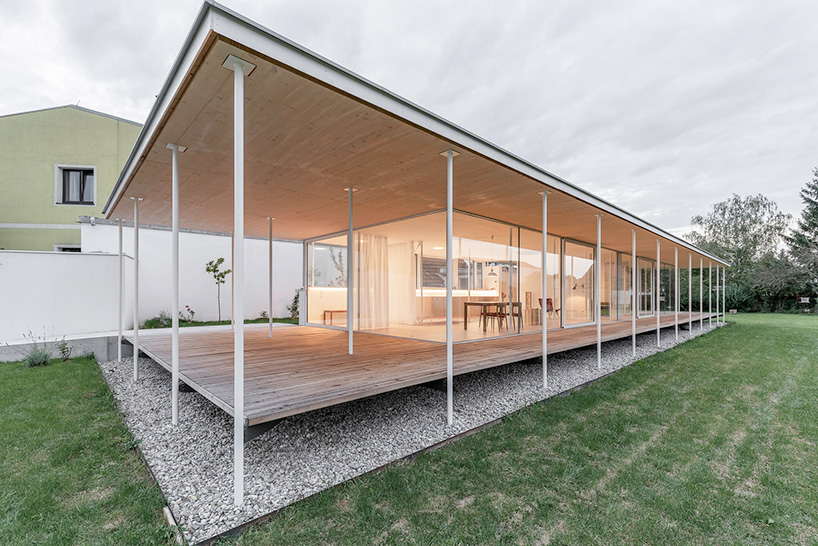 maximilian eisenköck completes a white, floating pavilion for sculpture artist in austria