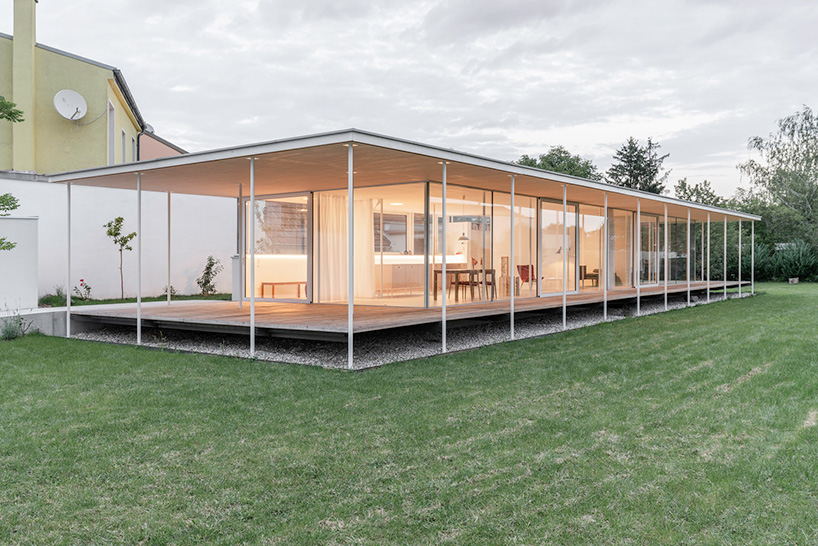 maximilian eisenköck completes a white, floating pavilion for sculpture artist in austria