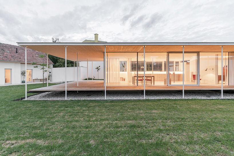 maximilian eisenköck completes a white, floating pavilion for sculpture artist in austria