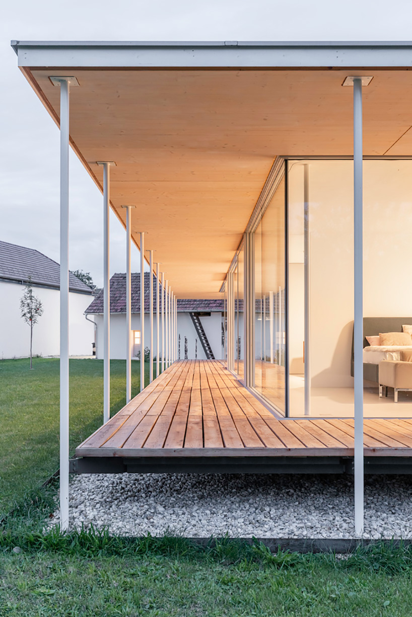 maximilian eisenköck completes a white, floating pavilion for sculpture artist in austria