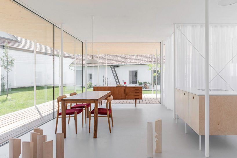 maximilian eisenköck completes a white, floating pavilion for sculpture artist in austria