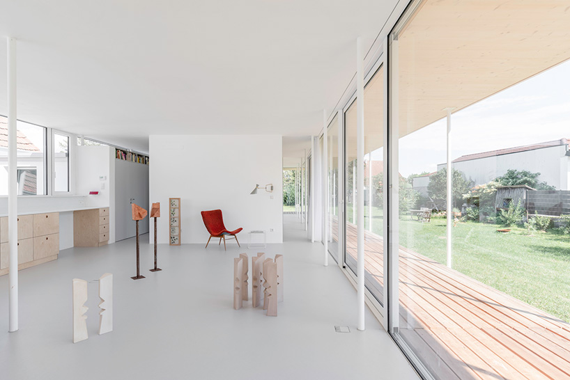 maximilian eisenköck completes a white, floating pavilion for sculpture artist in austria