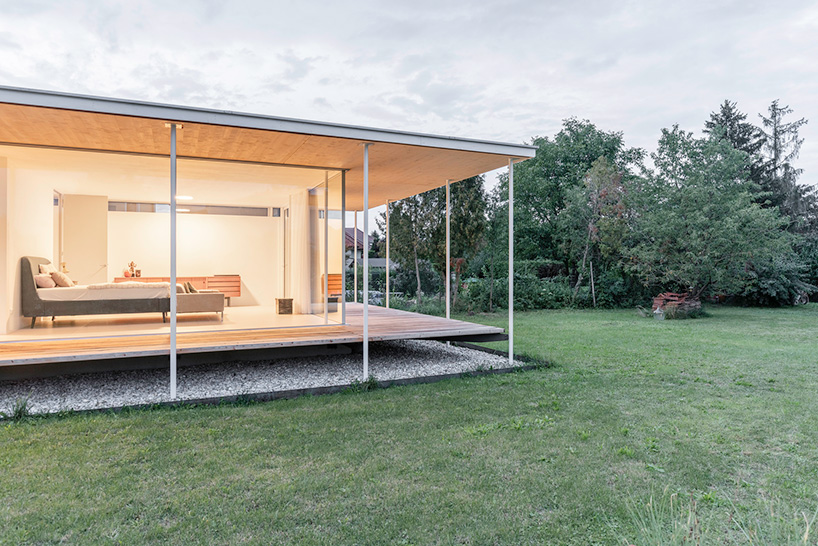 maximilian eisenköck completes a white, floating pavilion for sculpture artist in austria