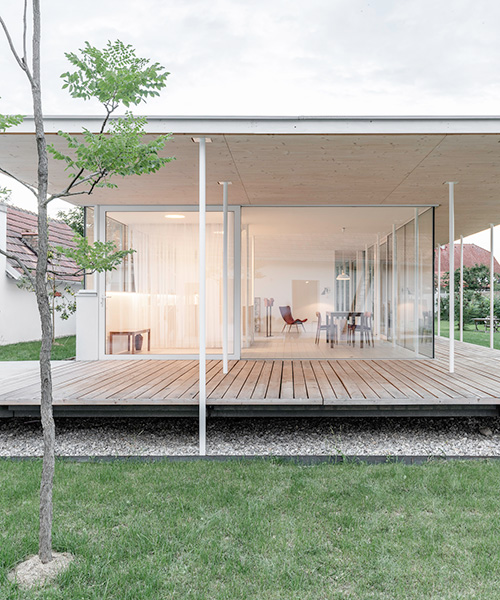 maximilian eisenköck completes a white, floating pavilion for sculpture artist in austria