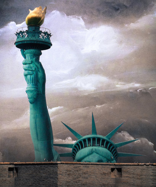 no-to-scale imagines a huge wall around lady liberty to remind us what she stands for